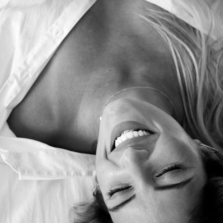 Kaveri Mehta, Lead Design Curator at Emerald Forest Valley, reviewing corporate floral arrangements